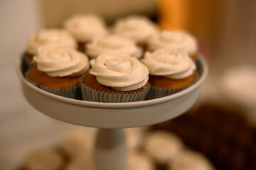 Chic White Cupcake Ensemble on Sophisticated Display Stand