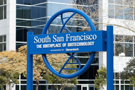 South San Francisco, CA, USA - Feb 23, 2024: The Birthplace of Biotechnology sign, sponsored by Genentech, is seen on a median strip of Grand Avenue in South San Francisco, California.