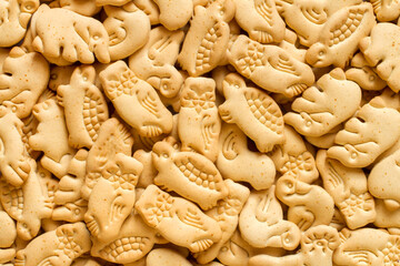 Lots of cookies in the form of animal figurines. Cookie texture. Fresh natural biscuits.