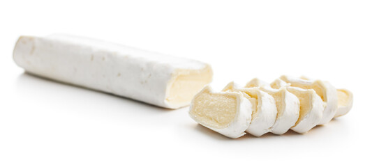 Sliced soft cheese on white background