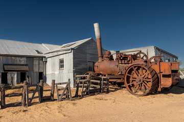 Rusted old tractor and woolshed