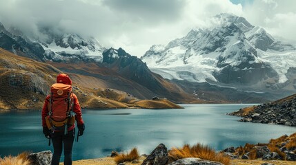 A hiker with a backpack stands before a flowing stream, looking towards the majestic snow-capped mountain peaks in the distance, enveloped by the vastness of the wilderness.