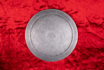 ancient round silver shield on a red background - 756236886