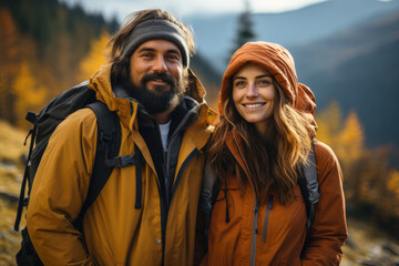 Couple with backpacks enjoying hiking in mountain