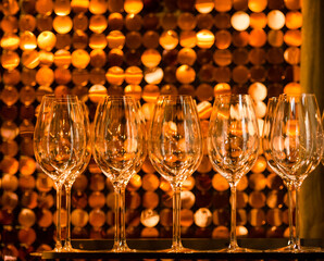 glasses of champagne against golden backdrop