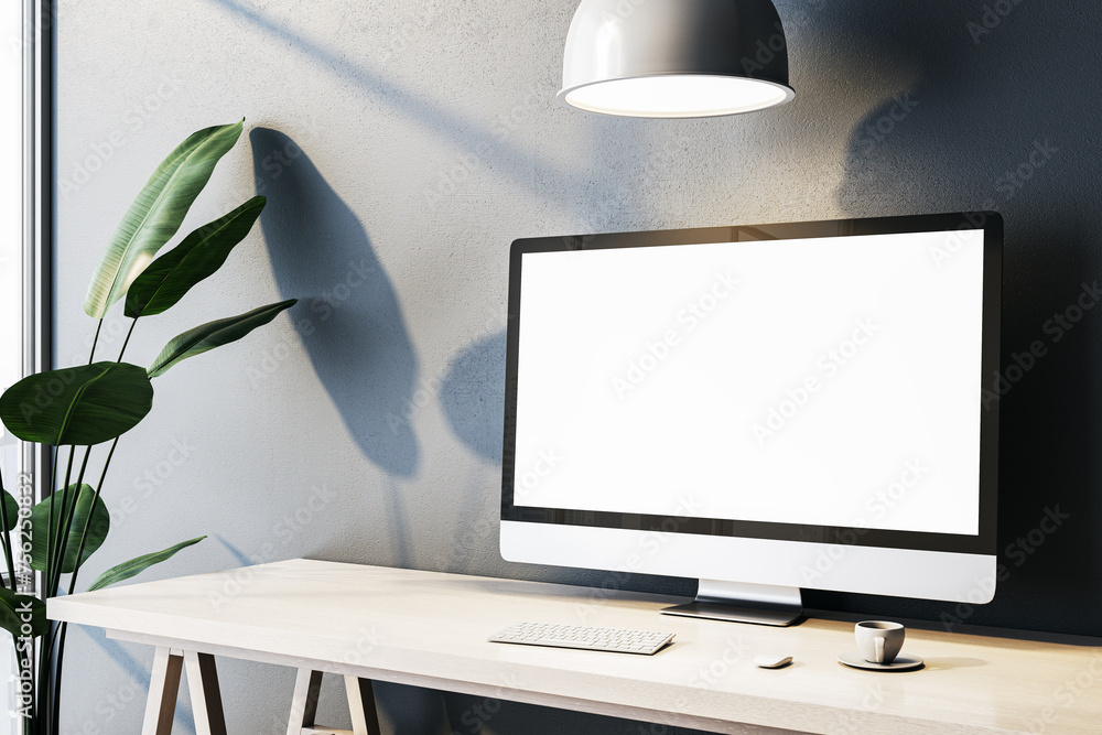 Poster Contemporary home office interior with empty white computer monitor on designer desktop. Concrete wall background with shadows. 3D Rendering.