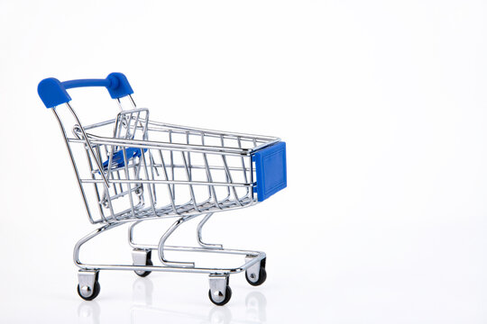 shopping cart, e-commerce, on white background. Copy space.