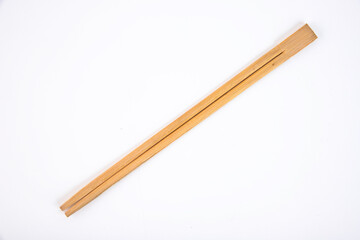 Wooden chopsticks on a white background. Copy space.