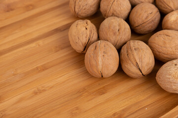 IRipe walnuts in the shell, the theme of healthy eating, vegetarianism, raw food diet.