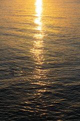 Sunset, sunlit path over the Red Sea in the south of Sinai, Sharm el Sheikh, Egypt.