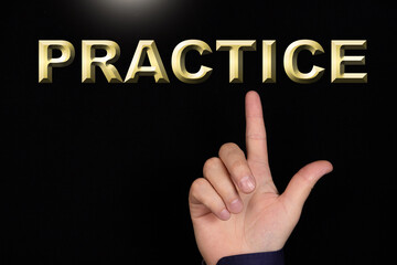 PRACTICE text, a word written on a black background pointed to by a hand with the index finger of a person.