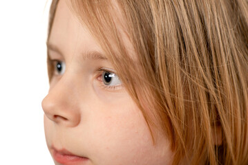 Detailed shot showcasing a ten-year-old boy's portrait, emphasizing the charm of his long hair against a clean white background