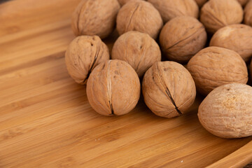 IRipe walnuts in the shell, the theme of healthy eating, vegetarianism, raw food diet.