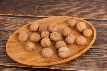 IRipe walnuts in the shell, the theme of healthy eating, vegetarianism, raw food diet.