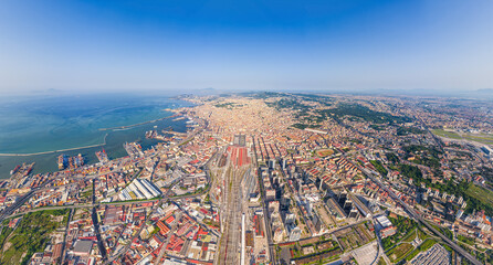 Naples, Italy. Train station - Napoli Centrale. Neapolitan Bay with ships. Panorama of the city on...