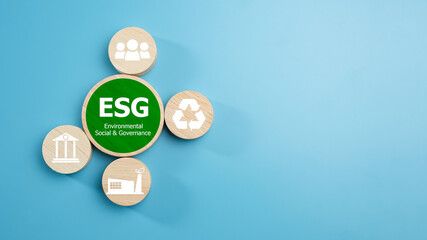ESG concepts for sustainable environment, society and governance Businesses are environmentally responsible, A circular wooden board with the abbreviation ESG printed on a light blue background. - obrazy, fototapety, plakaty