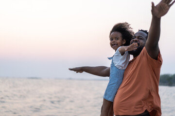 African love family father and daughter enjoying a carefree moment  strength and happiness as he...