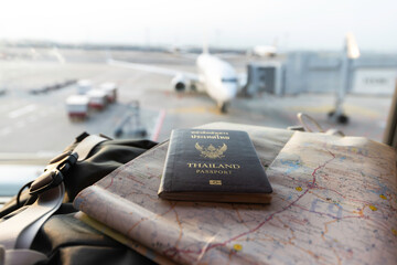 Travel planning concept, Hand holding Passport and Airline tickets with Airplane . Travel Concept - obrazy, fototapety, plakaty