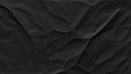 Black crumpled paper texture, damaged wrinkled paper. Abstract textured rumpled page background