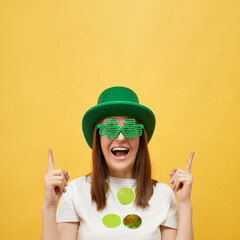 National holiday event. St. Patrick's Day mythology. Happy Caucasian woman wearing green leprechaun...