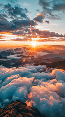 Fototapeta premium An aerial view of a spectacular sunset over the mountains, with spectacular clouds