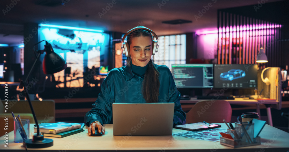 Poster portrait of a beautiful manager sitting at a desk in creative agency, using laptop computer. young s