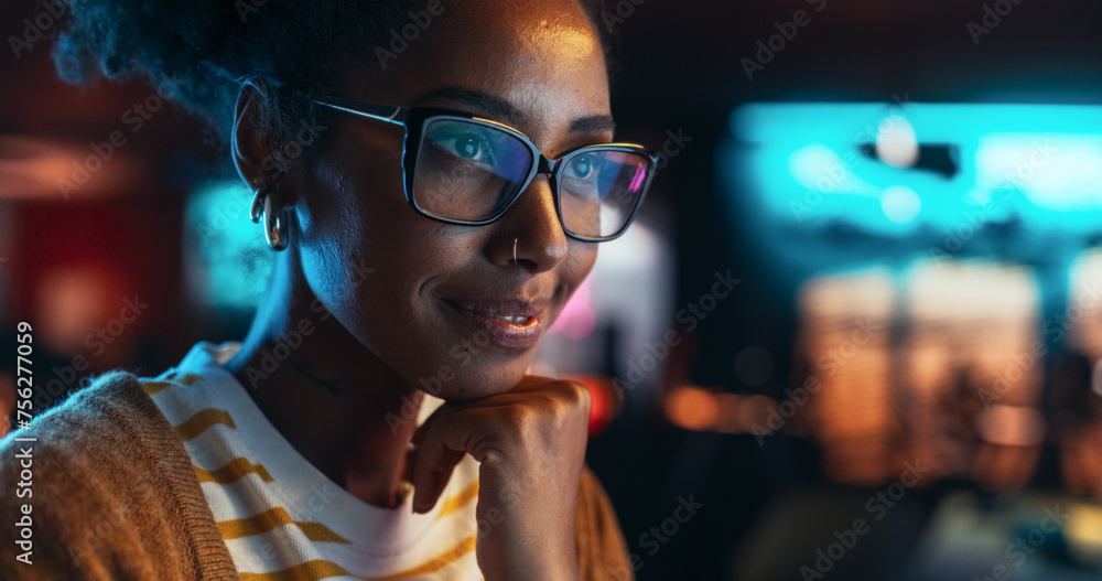 Fototapete portrait of a beautiful happy female using desktop computer, analysing data, thinking and solving pr