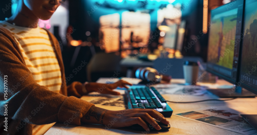 Aufkleber Portrait of Female Video Game Designer Working on a New 3D Level on Desktop Computer in Creative Office. Black Focused Woman Creating Metaverse and Adding Details to a Game Environment 
