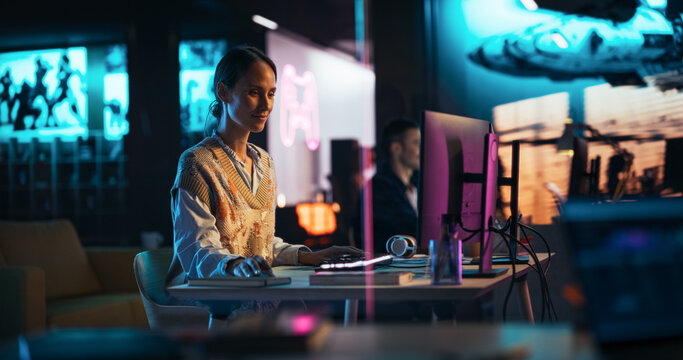 Portrait of a Beautiful Happy Female Project Manager Working in Creative Agency, Reviewing Marketing Strategy. Lead Specialist Using Desktop Computer, Analysing Data, Thinking and Solving Problems