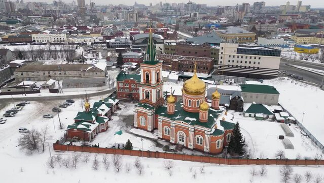 Aerial view of Christian Church in Barnaul on a winter day. Flying a drone over a winter cityscape, Siberia, Russia