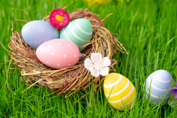 Easter basket with eggs in beautiful grass landscape in natural landscape - 756281490