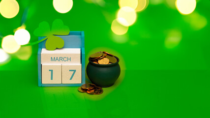 Save the date white block calendar for St Patrick's Day, March 17 on green background.
