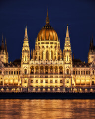 Fototapeta na wymiar Stunning night view of the illuminated Hungarian Parliament Building.