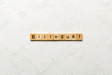 bilingual word written on wood block. bilingual text on table, concept © sosiukin