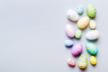 decorative easter eggs on colored background. easter eggs collection top view with copy space