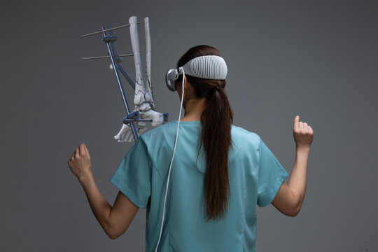 A medical professional explores human bone fractures using spatial computer