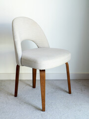 Modern chair with wooden legs on white room interior - 756286058