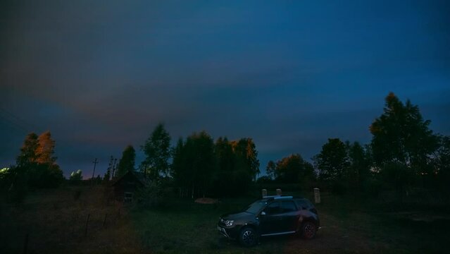 Blue Starry Sky Background Time Lapse. Bright Night Dramatic Sky With Star Trails Above Suv Car At Countryside. Bold Blue Timelapse Night Starry Sky. Summer Early Night.