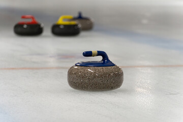 Curling stones, used to play the game of curling. Polished and shaped granite rocks with a handle...