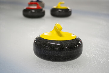 Curling stones, used to play the game of curling. Polished and shaped granite rocks with a handle...
