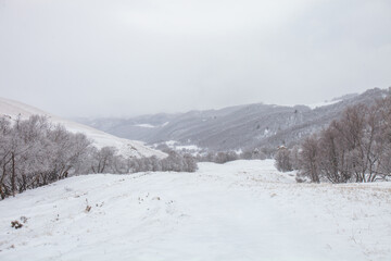 Fototapeta na wymiar Karachay-Cherkessia, Russia. Caucasus Mountains winter landscape.