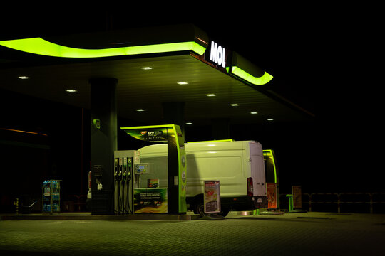 MOL gas station with logo sign. Hungarian oil company filling petrol station, with gasoline pump stands or fuel dispenser machines on February 21, 2024 in Suchedniow, Poland.