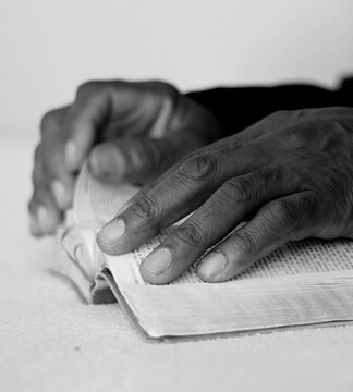 man praying with hands together with people stock image stock photo	