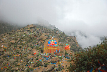 Buddha statue on the mountain of Drepung Monastery in Tibet