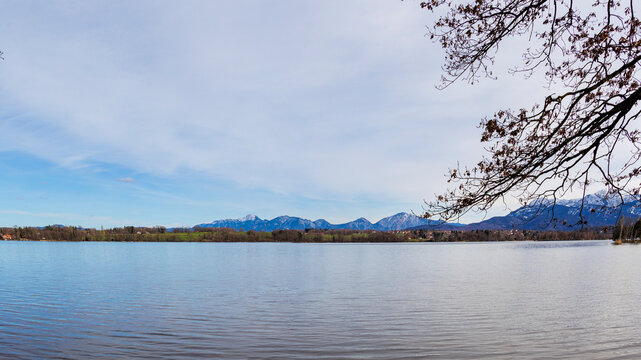 View over the Staffelsee in Bavaria from Uffing to the opposite shore and the Kochel mountains in the Alps