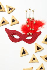 A mask with traditional cookies for the day of Purim.