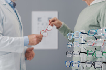 Patient having an eye text and choosing glasses