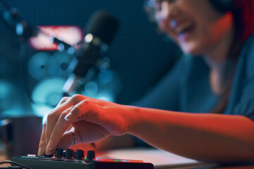 Radio host setting up a mixer