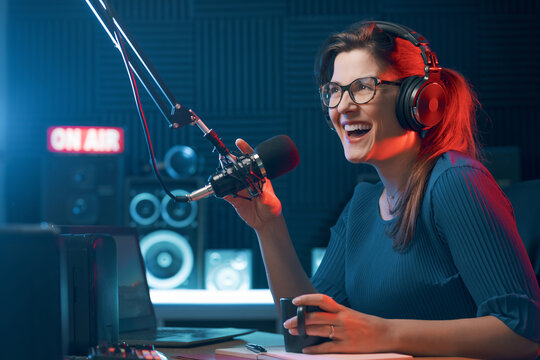 Smiling DJ hosting a radio show