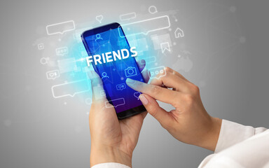 Obraz premium Hand using smartphone with social media concept